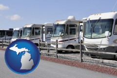 michigan map icon and recreational vehicles at an rv dealer parking lot