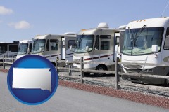 south-dakota map icon and recreational vehicles at an rv dealer parking lot