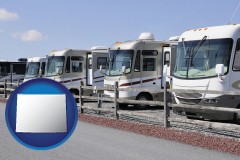 wyoming map icon and recreational vehicles at an rv dealer parking lot