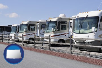 recreational vehicles at an rv dealer parking lot - with North Dakota icon